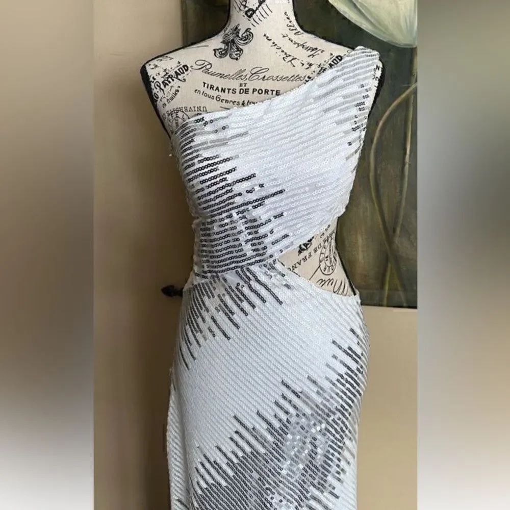 Clarisse boutiqe, white beaded ,Head turning gown, retails over $300